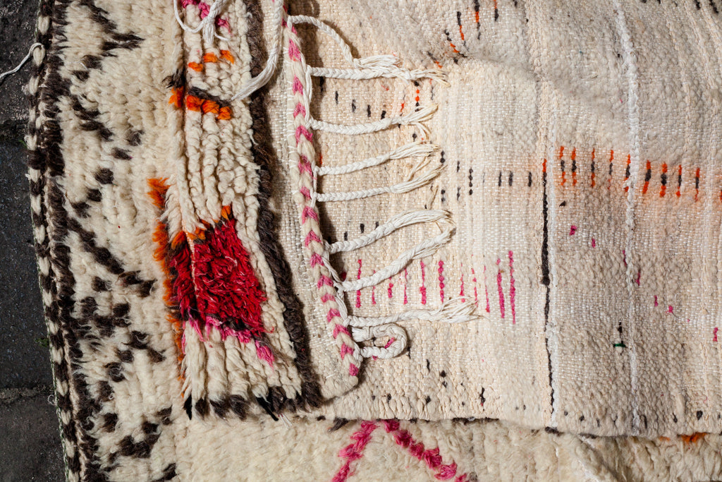 Close-up of the the reverse of the Azilal rug showing fringes and weave design.