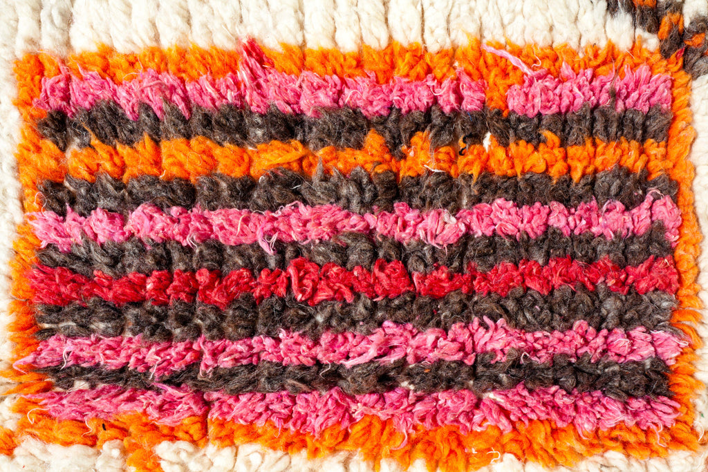 Close-up of the Azilal rug showing a striped, multicoloured Berber symbol that typifies Azilal rug design.