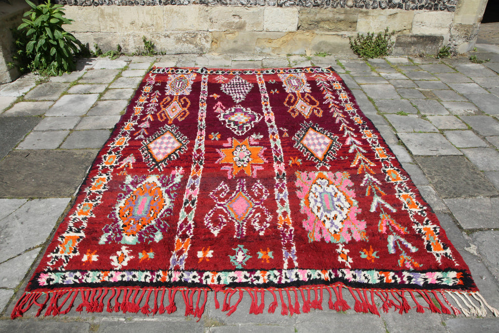 Beautiful, old, medium-sized Berber Moroccan pile Boujad rug with complex traditional tribal designs and motifs.