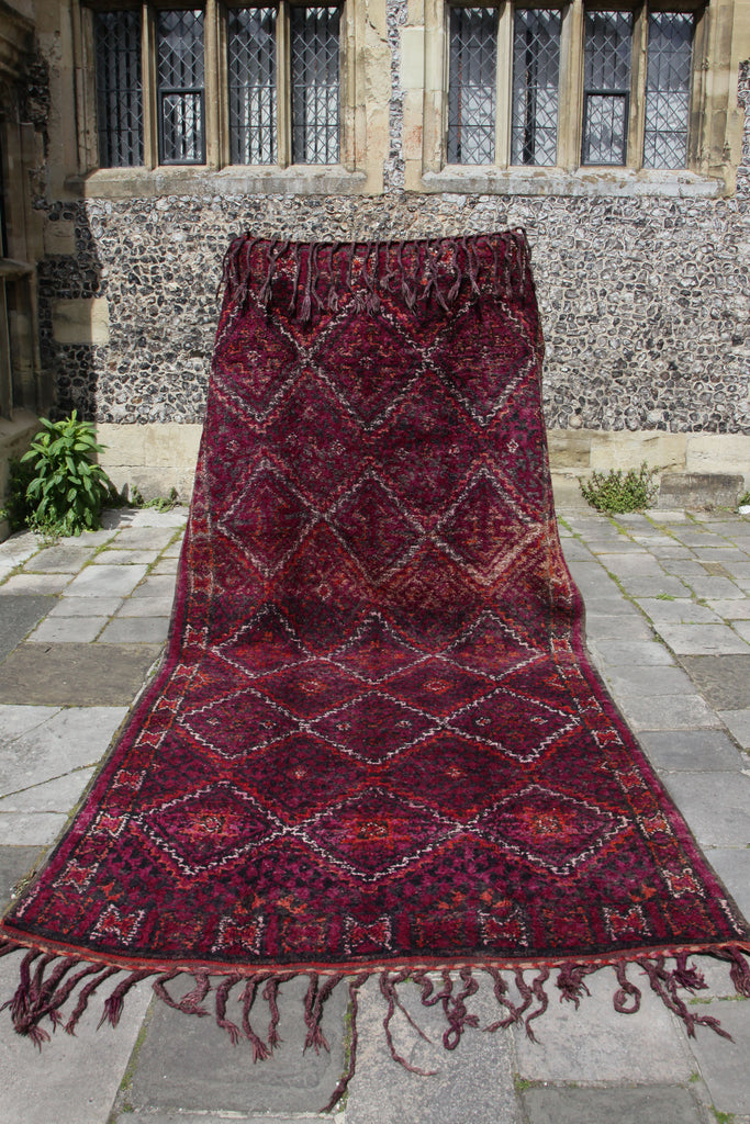 Beautiful Beni M'Guild raised at one end to show full extent of the rug and the intricate zigzag design.
