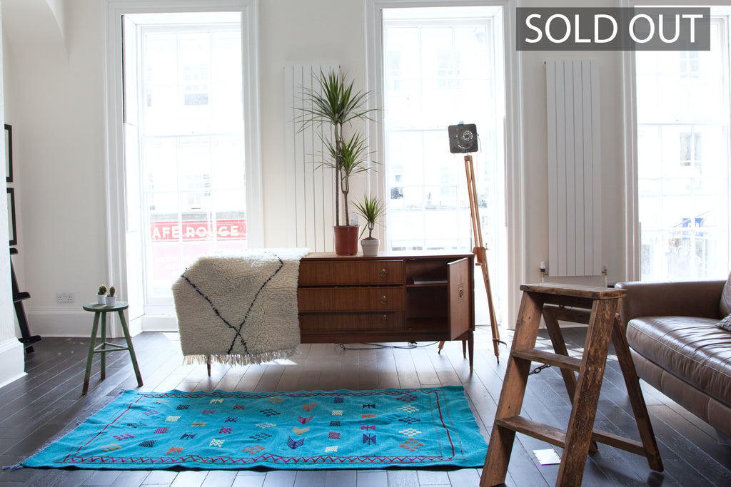 Hand-woven turquoise cotton chenille kilim with striking tribal designs and motifs. 