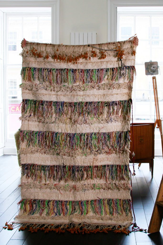 Reverse side of the Handira showing long loose loops of colourful cotton.
