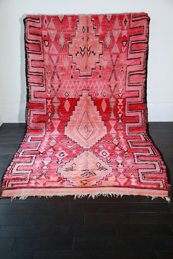 Hand-knotted, semi-antique, large Berber Moroccan pile rug with traditional tribal designs and motifs.