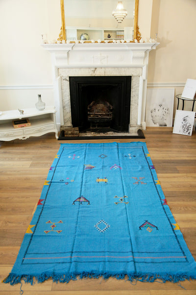 Hand-made, tribal cactus silk kilim rug, featuring finely woven, traditional Berber symbols.